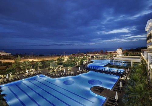 Alba Royal. Outdoor Pool By Night