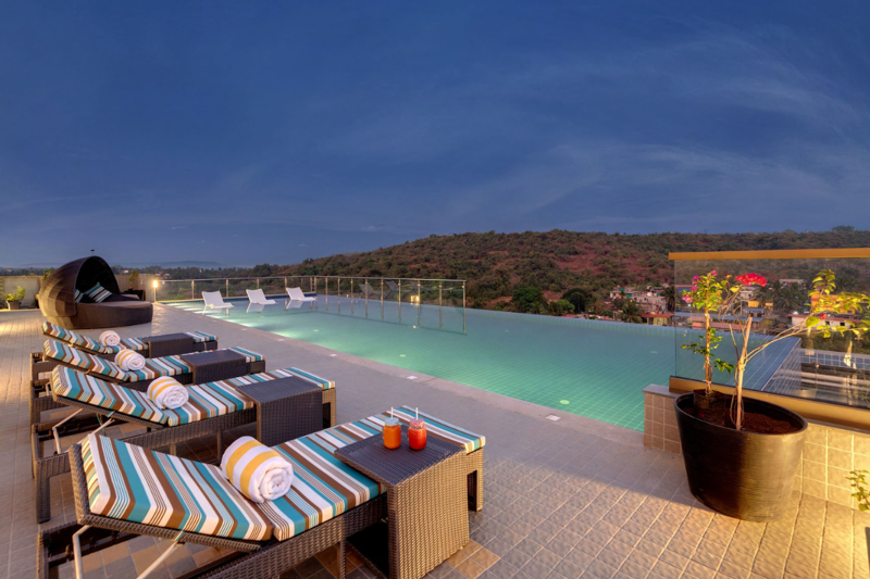 Rooftop infinity pool at The Fern Habitat Candolim in North Goa