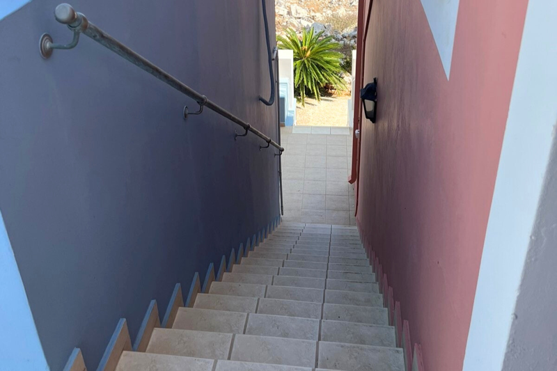External stairs lead to one bedroom apartment