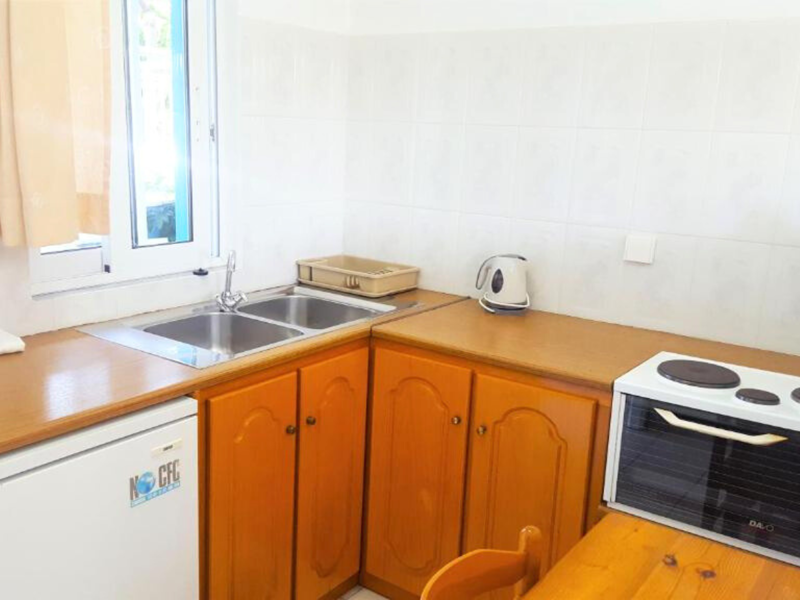 Kitchen's facilities at Blue White Apartments
