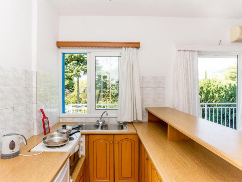 General view of kitchenette at Blue White Apartments