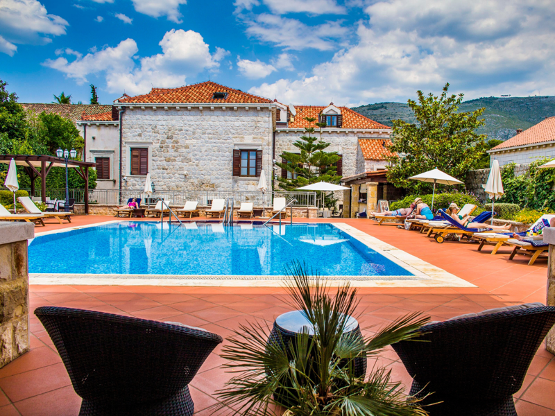 Swimming Pool and Sunbed Area at Hotel Kazbek